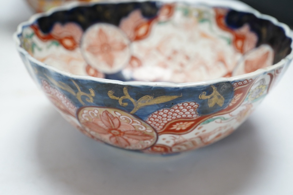 Japanese Kutani, Satsuma and Imari; four vases, a bowl, a pair of candlesticks and a pot (8). Condition - candle sticks damaged